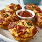 Pizza Muffins 3 Savory Pizza Muffins with cheese, tomato sauce, and pepperoni toppings