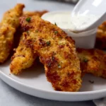Air fryer parmesan breaded fried chicken tenders on a plate