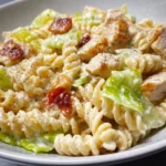 Chicken Caesar Pasta Salad recipe 3 Delicious Chicken Caesar Pasta Salad served in a bowl with dressing