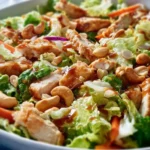 Chicken Cashew Crunch Salad topped with grilled chicken and crunchy cashews.