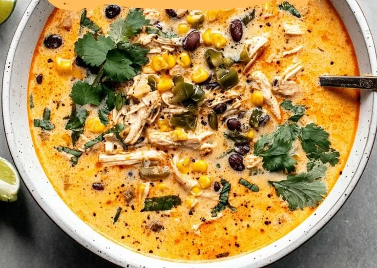 Delicious bowl of Chicken Poblano Soup garnished with herbs and spices