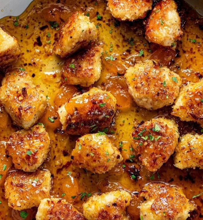 Succulent Coconut Peach Chicken served on a plate with fresh peach slices.