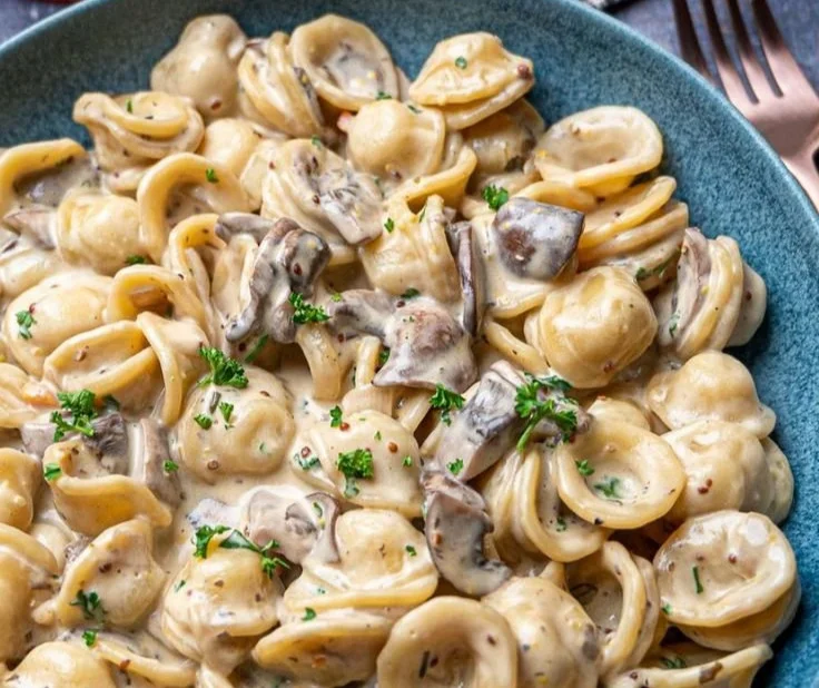 Creamy mushroom marsala pasta garnished with parsley and served in a bowl