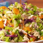 Bowl of delicious salad with fresh vegetables and vibrant colors