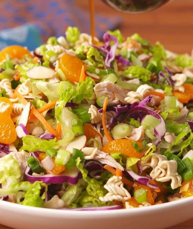 Bowl of delicious salad with fresh vegetables and vibrant colors