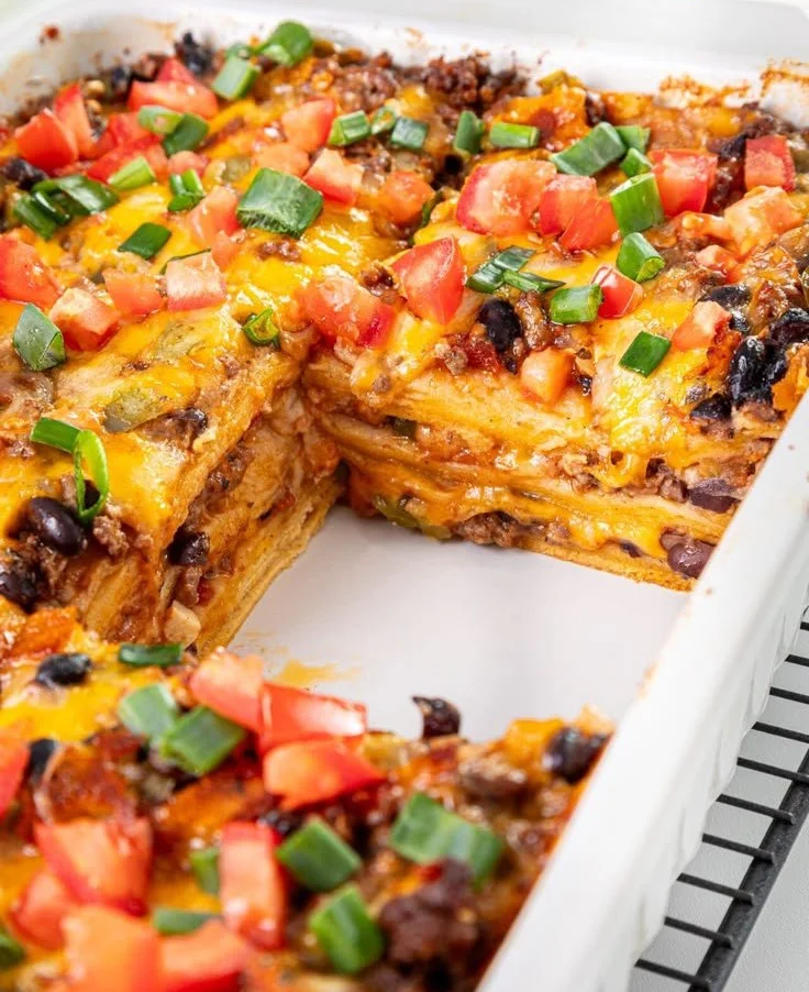 Delicious Easy Mexican Lasagna with layers of cheese, beans, and spices.