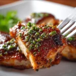 Delicious Garlic Brown Sugar Chicken garnished with fresh herbs.