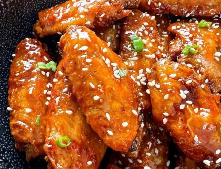 Delicious honey garlic chicken wings garnished with sesame seeds