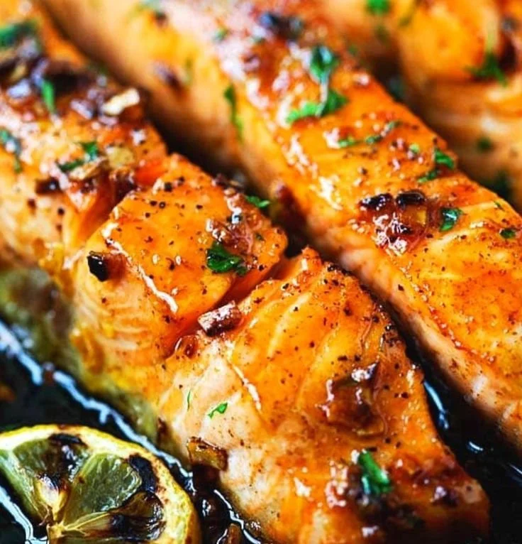 Delicious Honey Garlic Salmon recipe served on a plate with fresh herbs
