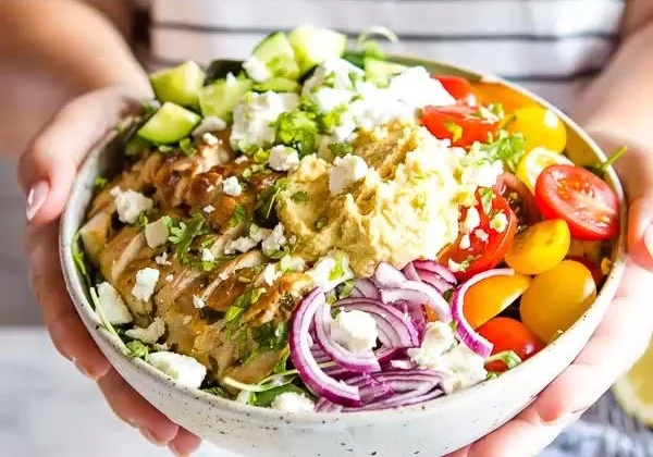 Low carb chicken shawarma bowls served with fresh vegetables and spices.
