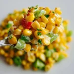 Delicious Shoepeg Corn Salad with colorful vegetables and dressing.