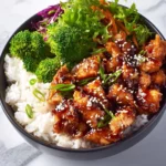 Sticky Teriyaki Chicken Bowl 3 Sticky Teriyaki Chicken Bowl topped with garnishes and served in a bowl