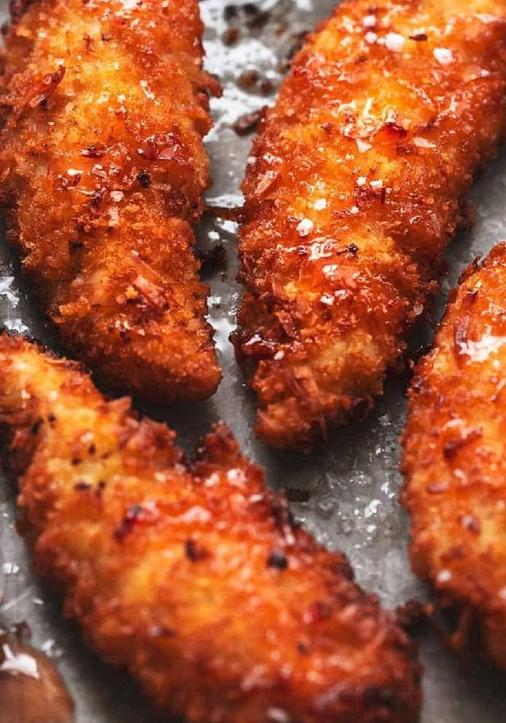 Sweet and crispy coconut chicken tenders served on a plate