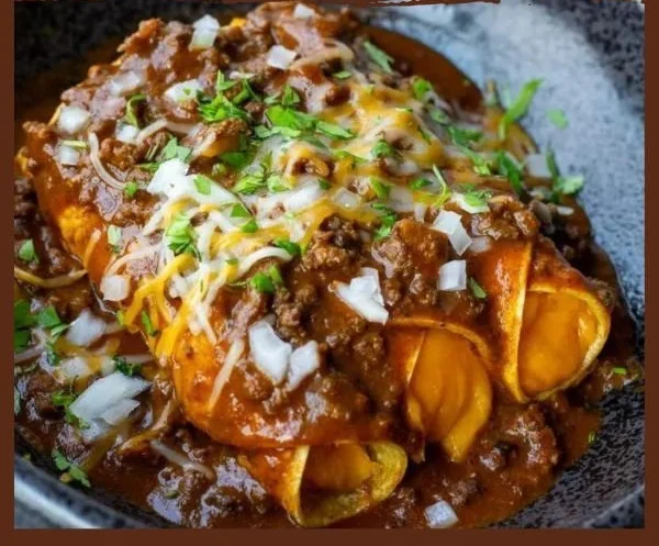 Delicious Tex Mex enchiladas served with toppings and garnishes.