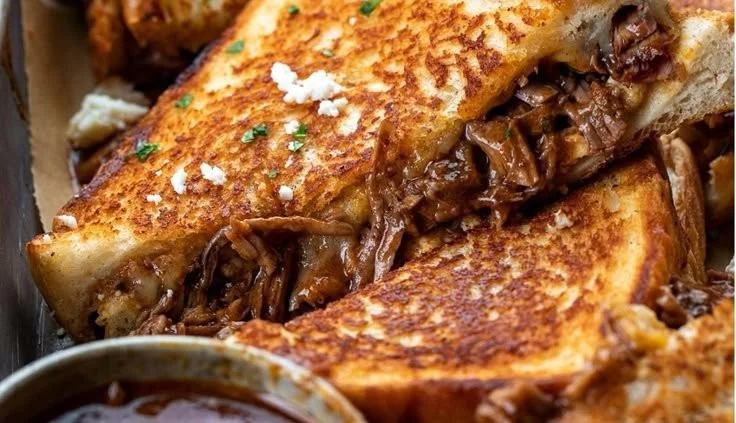 Delicious Birria Grilled Cheese with melted cheese and savory birria meat