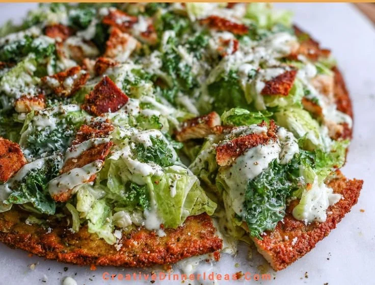 Delicious Chicken Caesar Salad Pizza with fresh ingredients and toppings.
