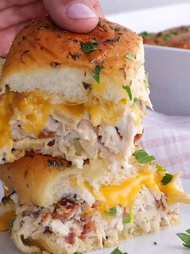 Delicious Crack Chicken Sliders topped with fresh ingredients and served in soft buns.
