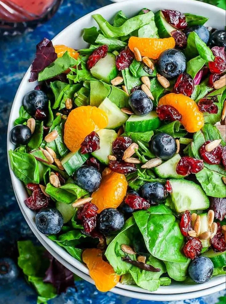 Fresh Cranberry Blueberry Salad topped with Blueberry Balsamic Dressing