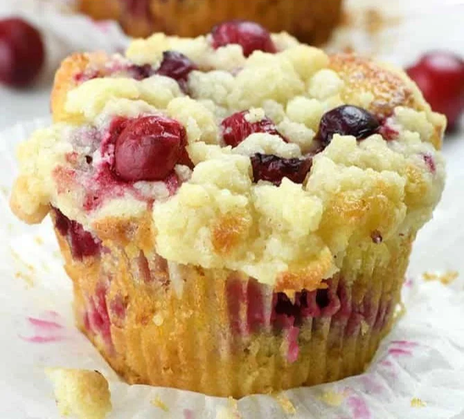 Freshly baked Cranberry Orange Muffins topped with streusel for added flavor.