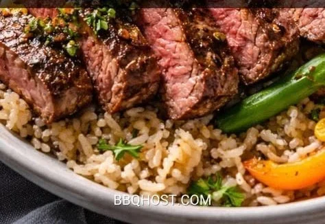 Delicious smoky steak bowl with rice and veggies served in a bowl