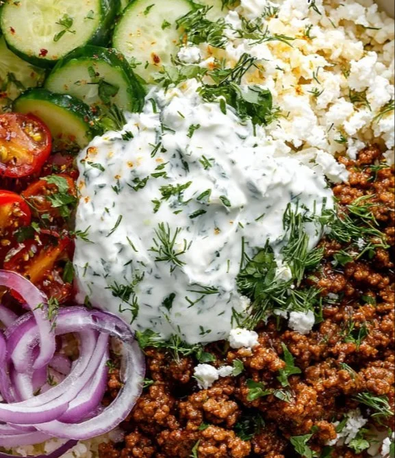 Greek Ground Beef Bowl topped with fresh Tzatziki sauce