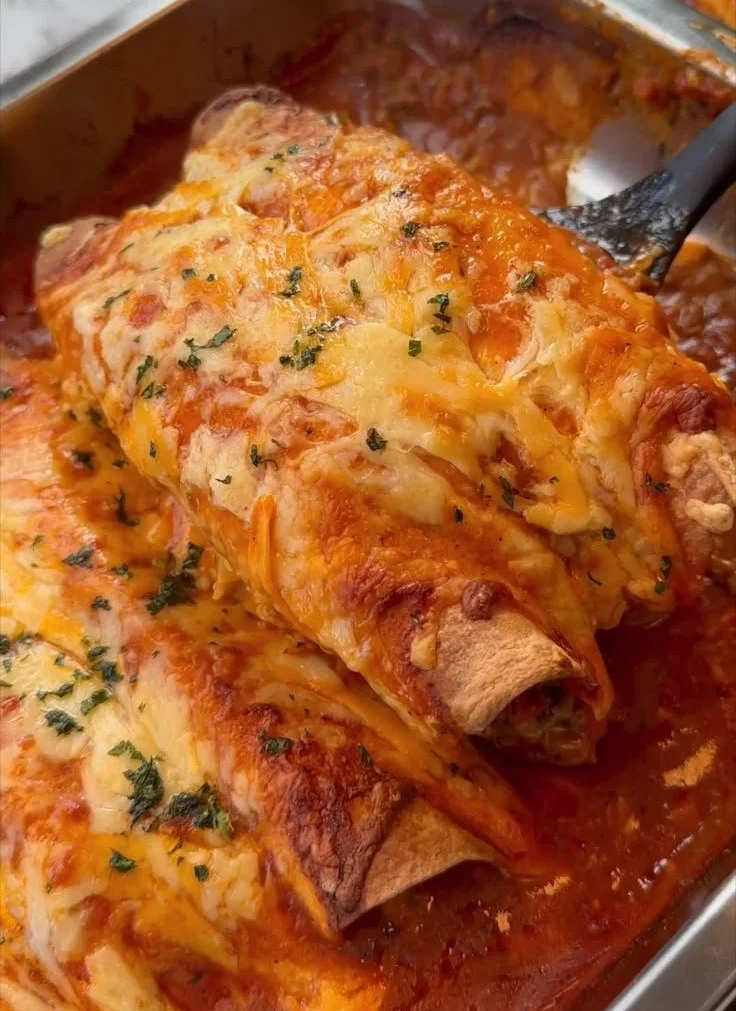 Delicious ground beef enchiladas topped with cheese and salsa