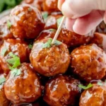 Honey BBQ Crockpot Meatballs 3 Delicious honey BBQ crockpot meatballs served on a platter.