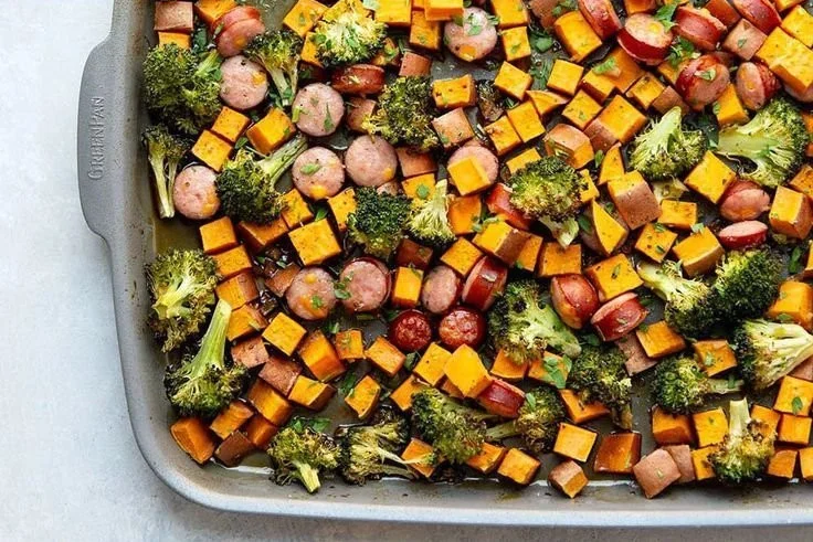 Plate of honey garlic sausage served with roasted sweet potatoes