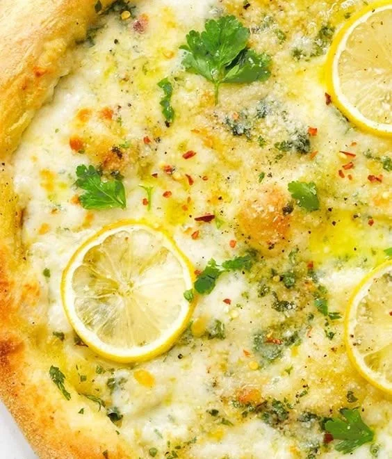 Delicious homemade Lemon Pizza topped with fresh ingredients and lemon zest.