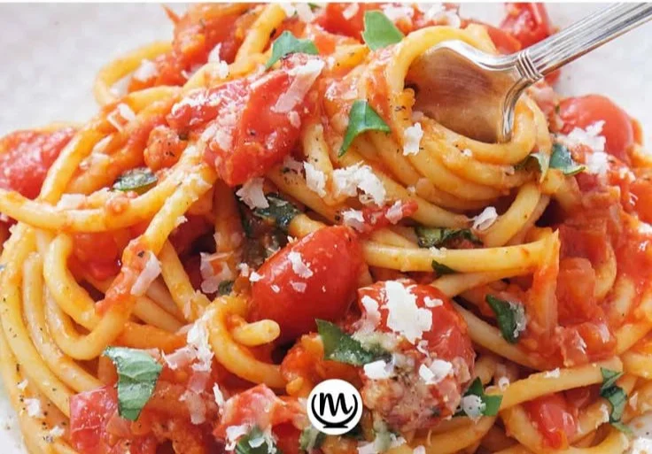 Plate of authentic Neapolitan Pasta topped with fresh ingredients