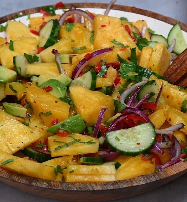 Colorful pineapple salad with fresh ingredients in a bowl