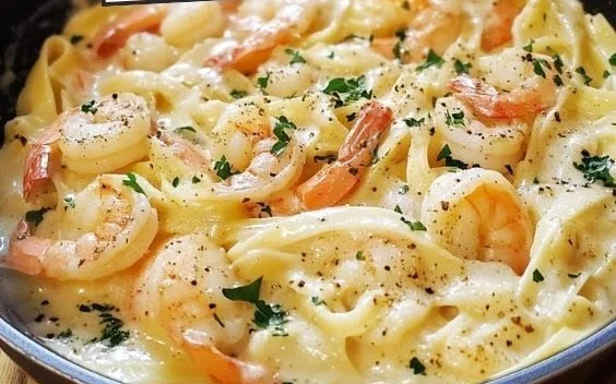 One pot shrimp and crab alfredo dish with creamy sauce and seafood