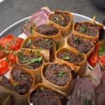 Sheet Pan Mediterranean Pinwheel Beef Kebabs 3 Sheet pan Mediterranean pinwheel beef kebabs served on a platter