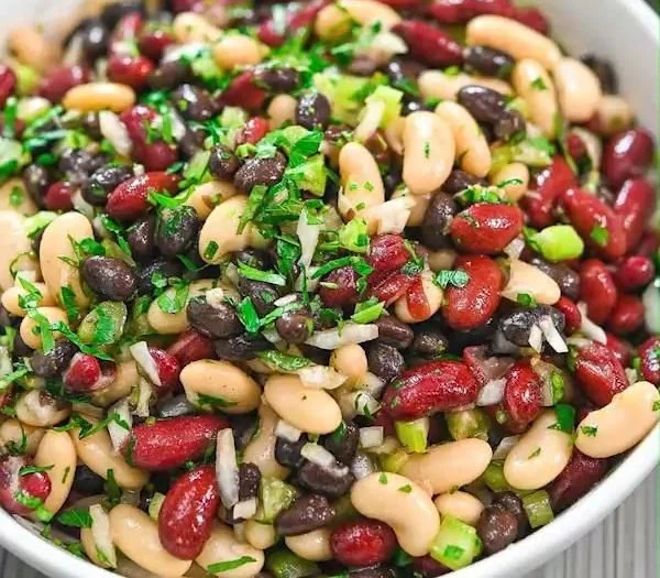 Three Bean Salad with colorful beans, vegetables, and a zesty dressing