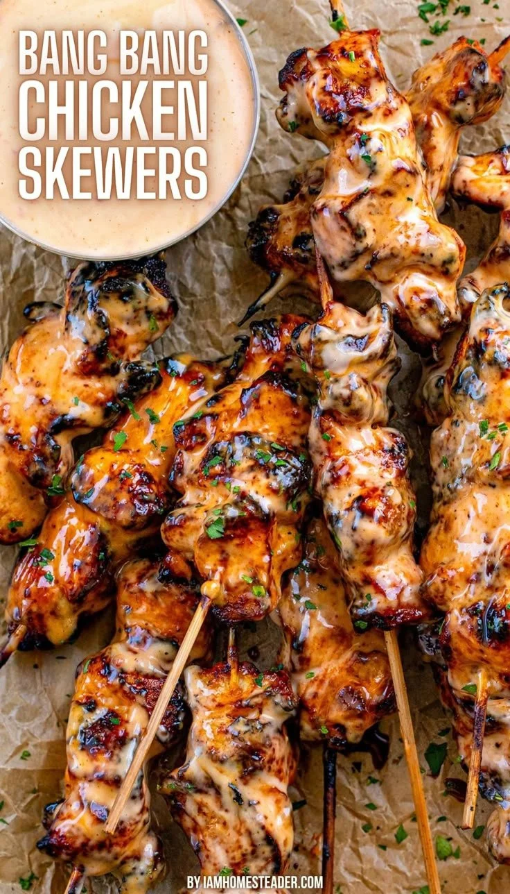 Delicious Bang Bang Chicken Skewers served with dipping sauce