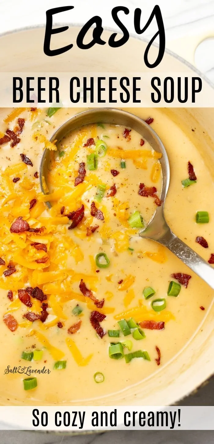 A bowl of creamy Beer Cheese Soup with bread on the side