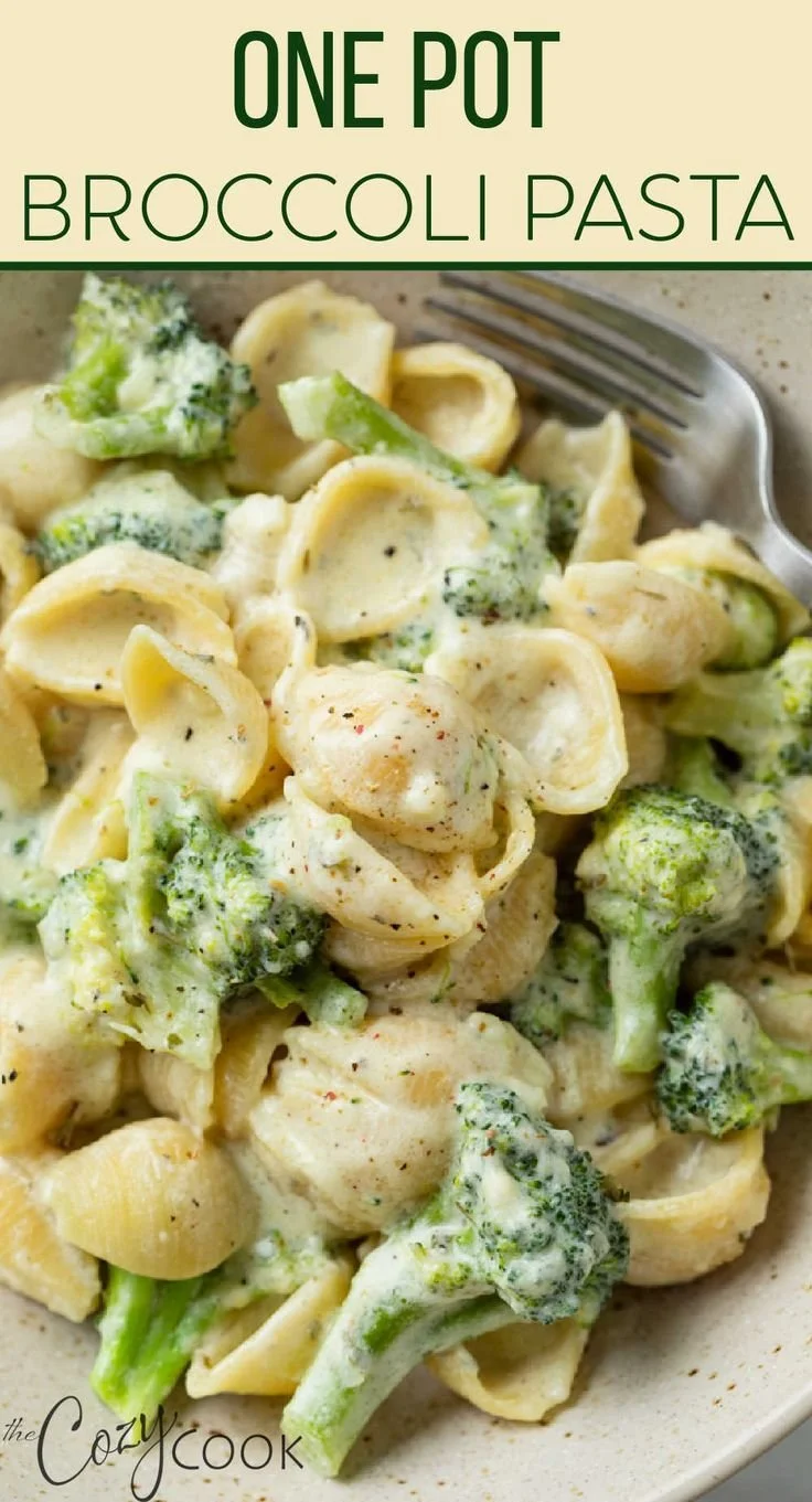 Plate of delicious Broccoli Pasta garnished with fresh herbs and parmesan cheese