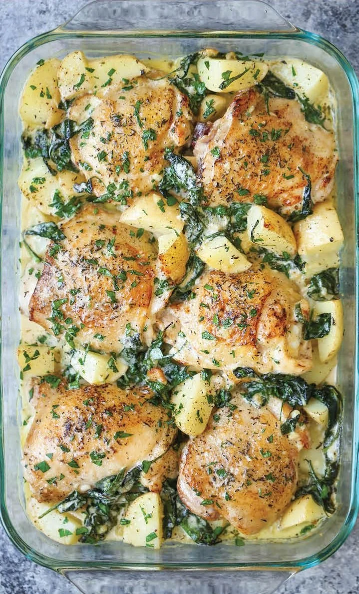 Chicken and potatoes in garlic parmesan cream sauce served on a plate