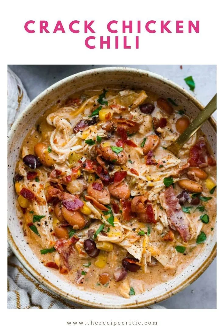 A hearty bowl of creamy Crack Chicken Chili topped with cheese and green onions.
