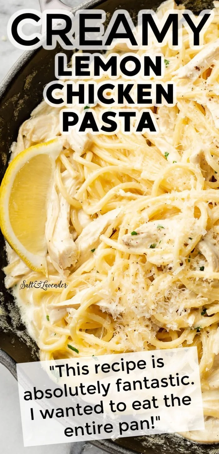 Creamy lemon chicken pasta served in a bowl with fresh herbs and lemon wedges.