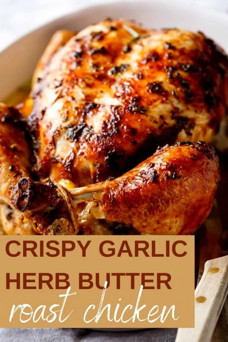 Crispy garlic herb butter roast chicken served on a dinner plate
