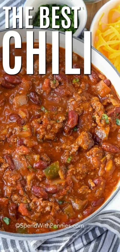 Bowl of easy homemade chili topped with cheese and herbs