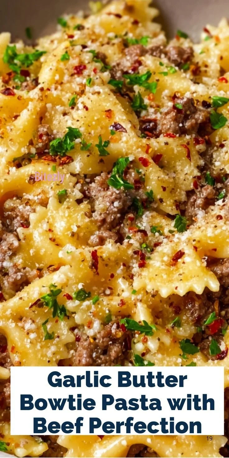 Garlic Butter Bowtie Pasta with Beef served on a plate, garnished with herbs.
