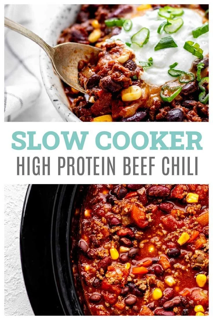 A bowl of high protein chili topped with fresh herbs and served with bread.