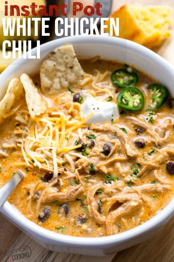 Bowl of Instant Pot white chicken chili garnished with cilantro and lime