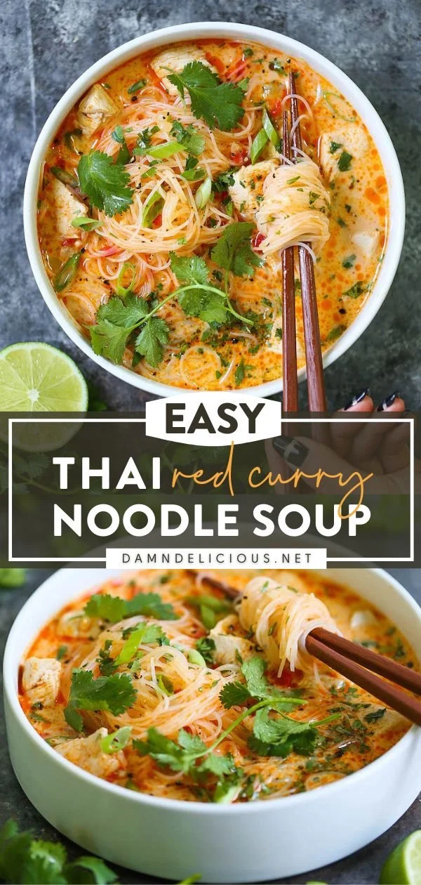 A bowl of red curry chicken soup garnished with fresh herbs and spices.