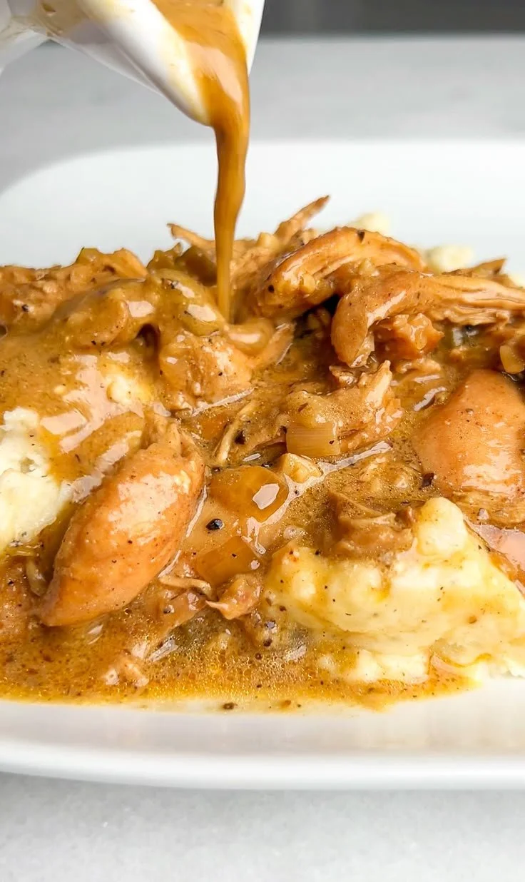 Delicious smothered chicken served with rich gravy on a plate