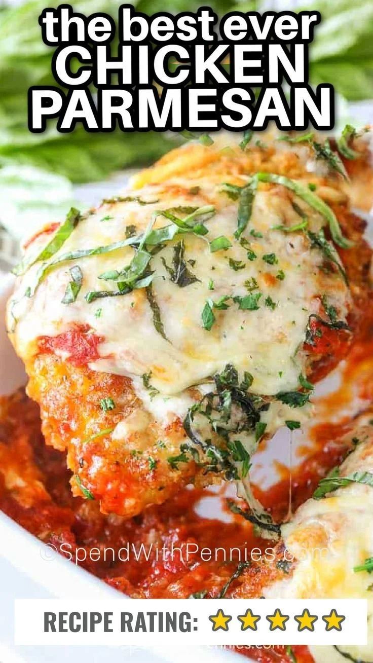 Delicious chicken parmesan with melted cheese and marinara sauce served on a plate.